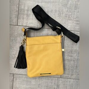 Steve Madden Crossbody Mustard Yellow With Black Tassel & Logo Strap